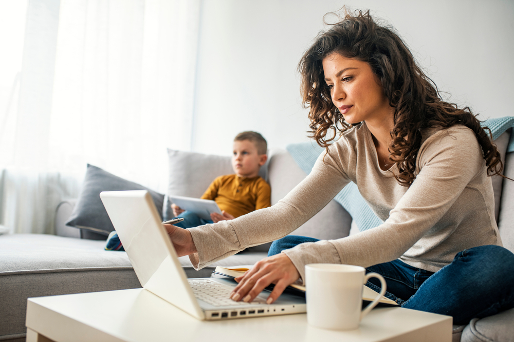 Mom and son connecting to Internet at home